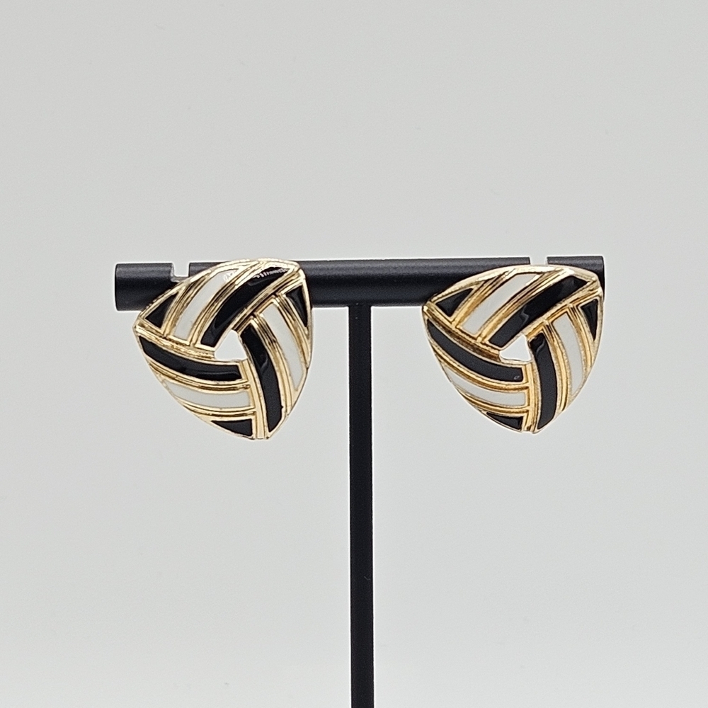 large triangular gold tone earrings with black and white enamel